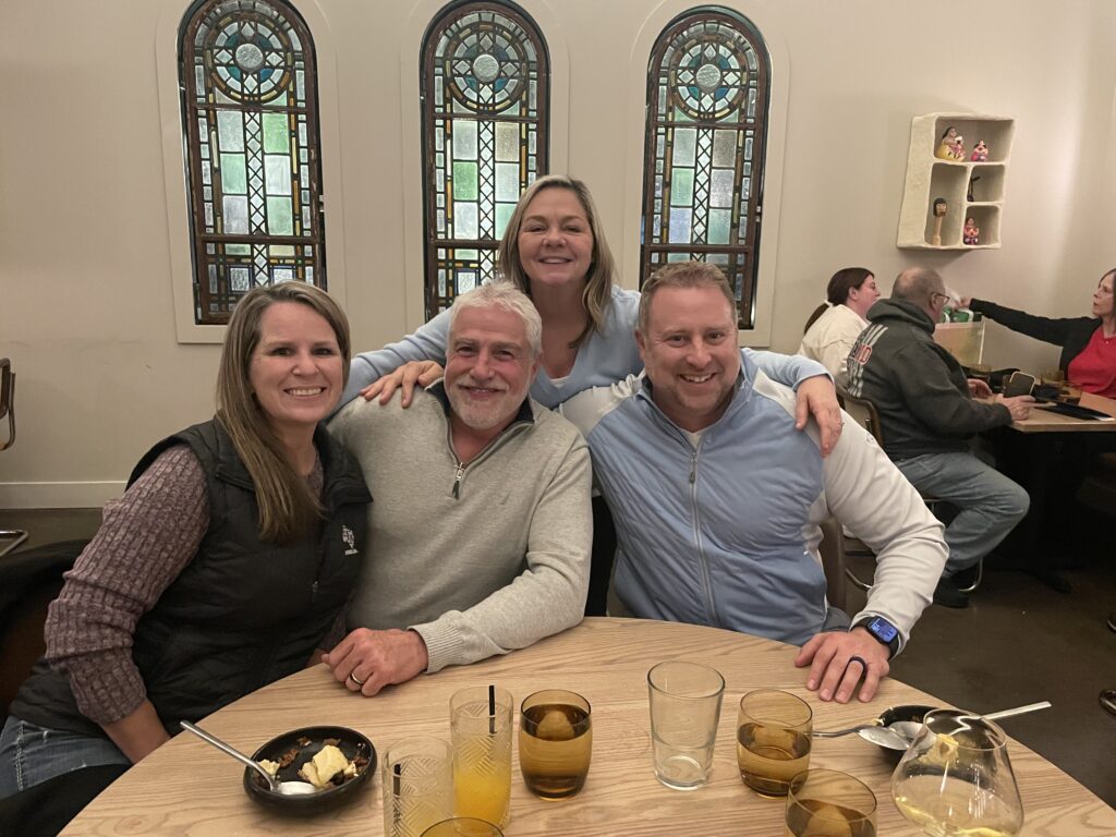 Toby Potter and Angie Potter with Jamie Bateman and his wife at the Market Street Apartments redevelopment site in Evansville, Indiana.